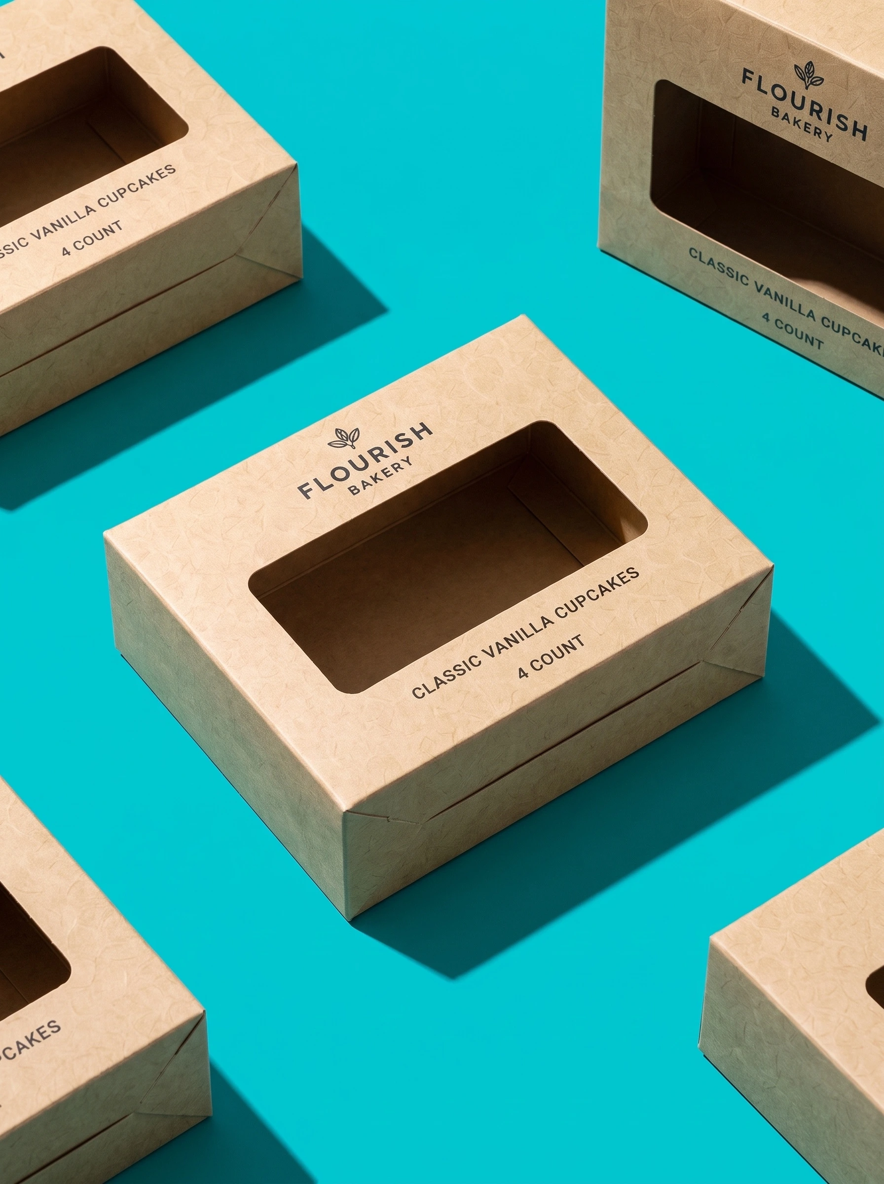 Several kraft bakery boxes with die-cut windows